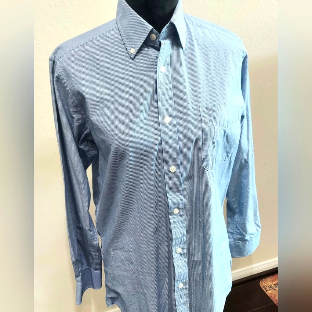 Blue long sleeve shirt with white stripes and buttons on the collar